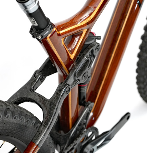 HTech custom wooden mountain bike with carbon rear suspension linkages