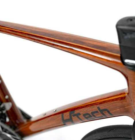 HTech Aeriform down and top tubes, reflections on gloss finish highlighting wood grain and tube shape