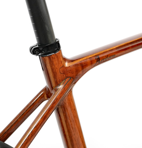 Close-up of the wooden HTech Aeriform seat tube junction, showing wood grain and mitering details