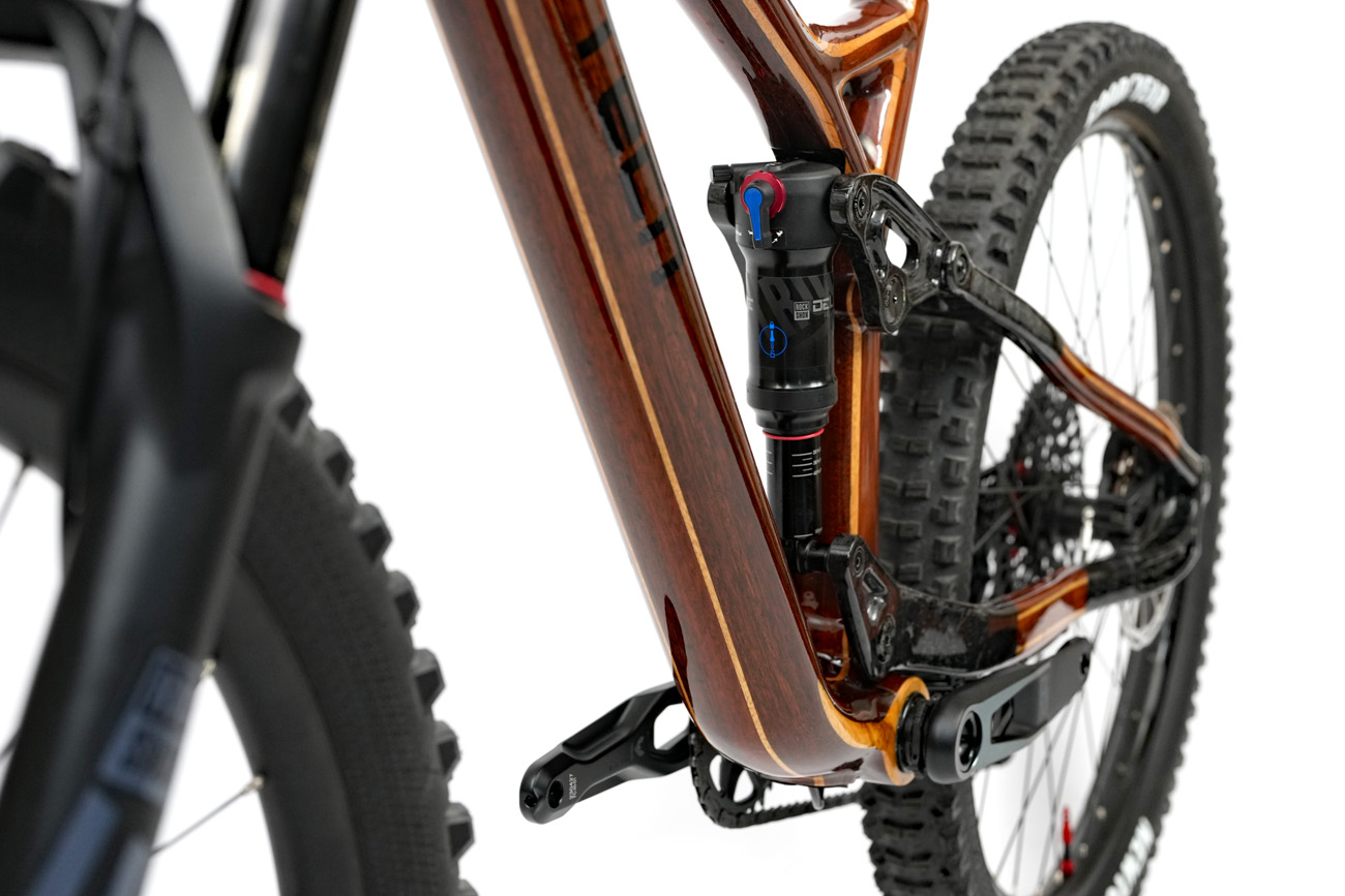 High gloss custom HTech Bikes mountain bike bottom bracket with Rock Shox Deluxe shock and suspension linkages